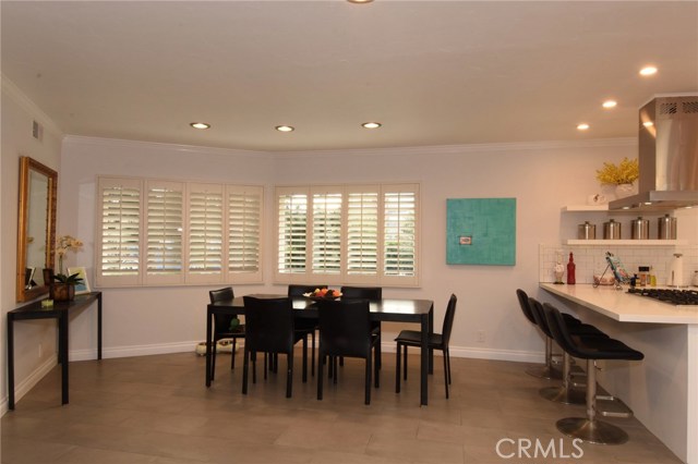 Large dining area is right off the kitchen and family room area.  There is a terrific bar counter too!