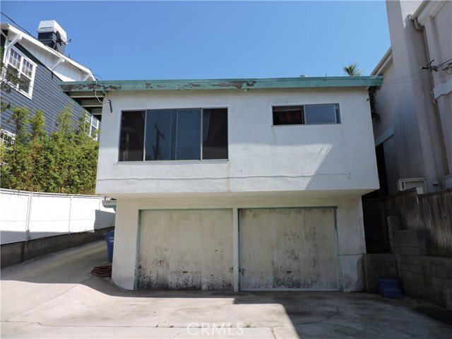 Two single car garages below one bedroom unit.