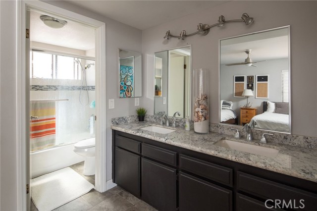 Upgraded baths with granite tops, shower surrounds and shower enclosures