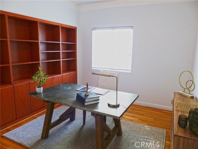 Bedroom 2/office on mid-level with built-in bookcases