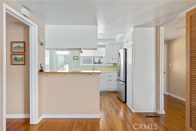 Open Kitchen with Breakfast Bar and Utility Closet