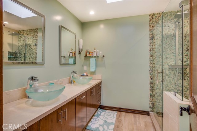 Bathrooms recently remodeled with skylight.