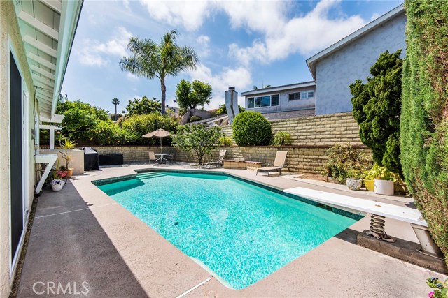 Backyard with pool and diving board Backyard with pool and diving board