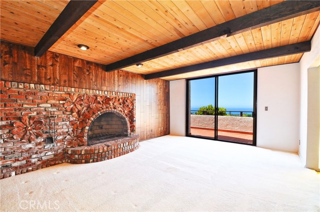 Custom fireplace in formal living room with ocean view.