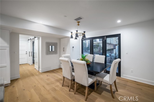 Dining area with accordian doors expand to include the side patio