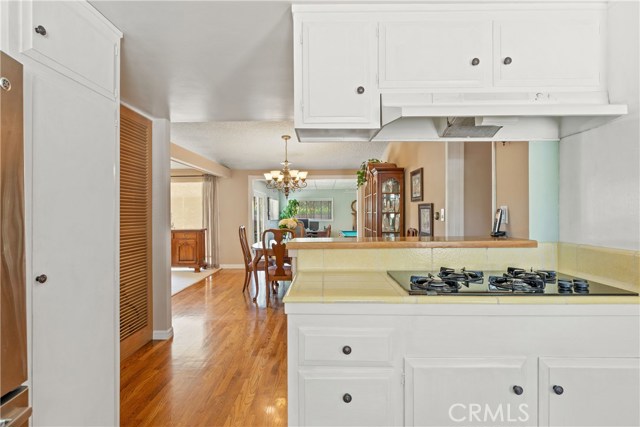 Kitchen overlooks Dining Room and Family Room