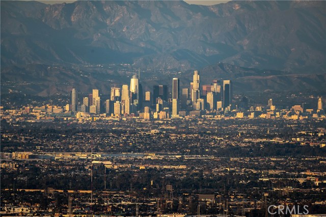 Close up of Dazzling Downtown LA with backdrop of mountains.