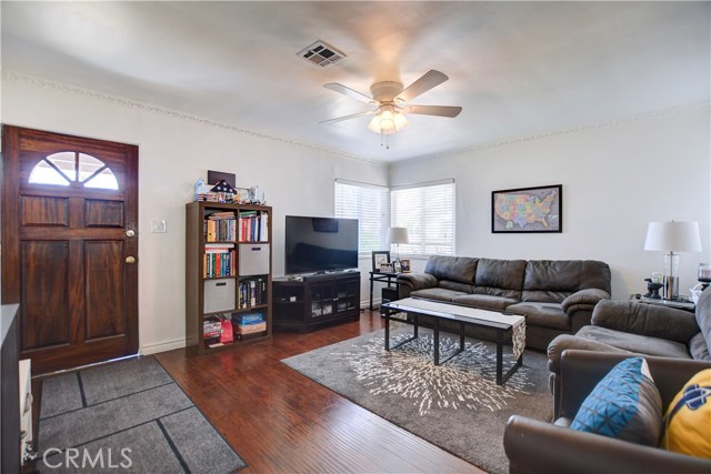 Unit A living room, wood floors, ceiling fan