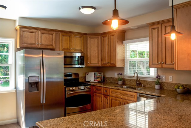 Remodeled kitchen with granite counters and stainless appliances