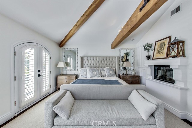 See thru fireplace (into suite bathroom) adds some charm to this wonderful room.