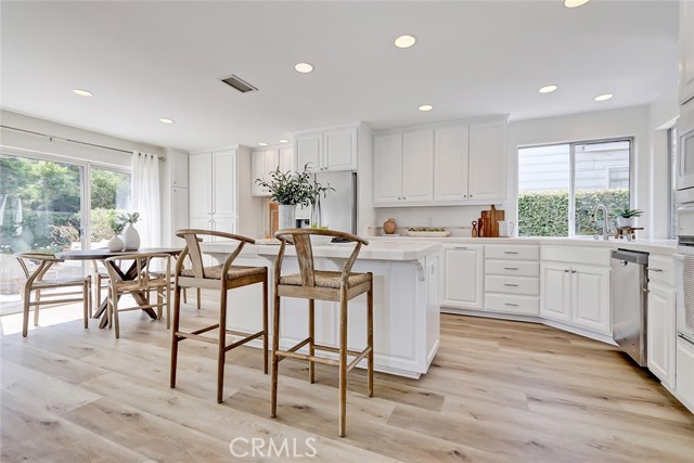 MAIN FLOOR KITCHEN WITH BREAKFAST BAR AND BREAKFAST NOOK AREA
