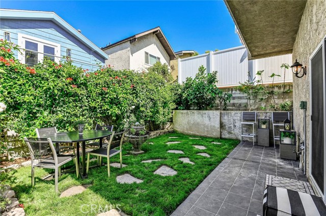 This space is hidden, lush and inviting. Drought tolerant fountain planter is amazing. String the lights across the space and then candlelight dinner anyone?