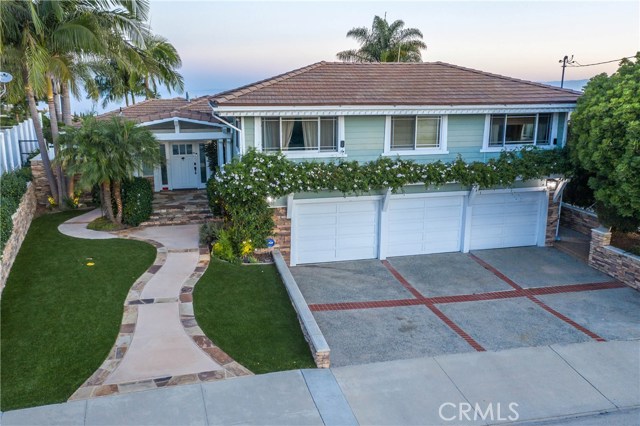 Slight aerial with ocean in the background.  Hurry on this once in a lifetime home!