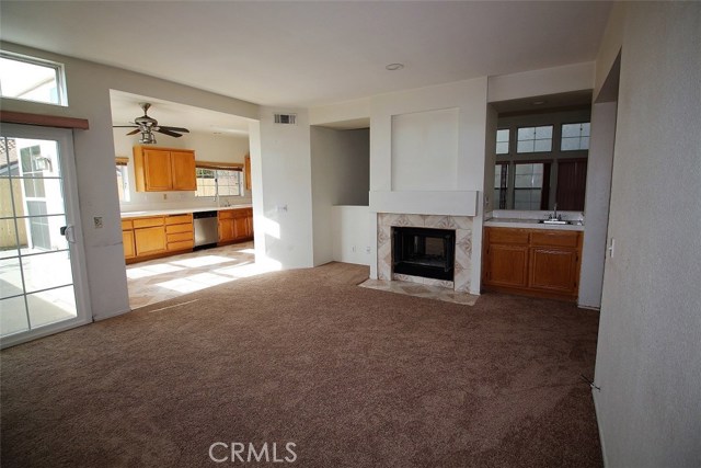 View of family room with fireplace and kitchen