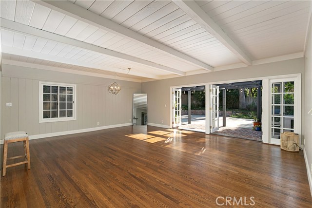 Beamed ceilings, solid maple and white oak floors, and french doors leading out to the backyard.