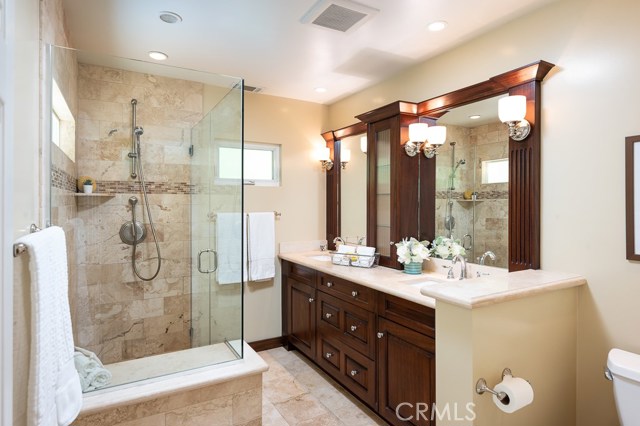 Updated premier bath with dual vanities and large shower.