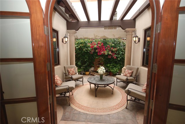 Outdoor center courtyard with pergola and fountain