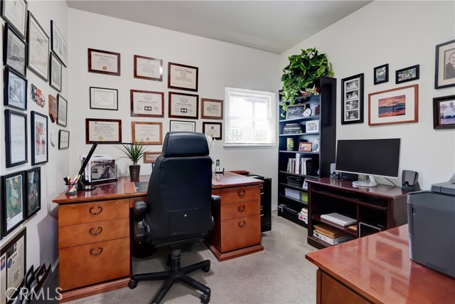 Sequestered away - a quiet office area created from one of the garage bays - without a permit - still leaving room for a porsche!