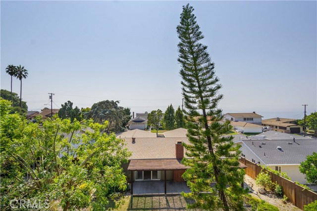 A view from the deck looking out over the home to the Pacific Ocean.