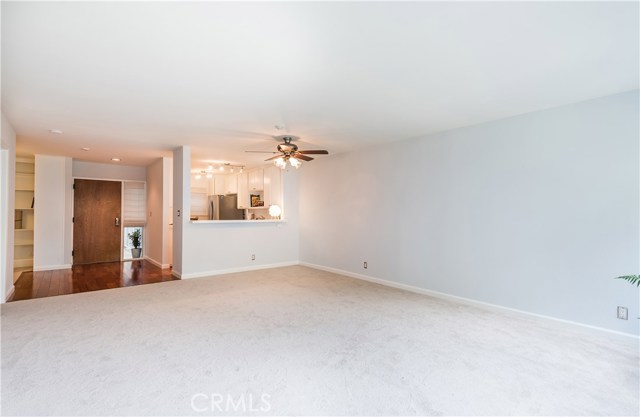 Large living room with ceiling fan.