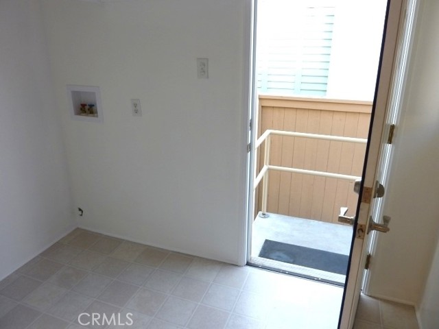 Green laundry room w/door to backyard