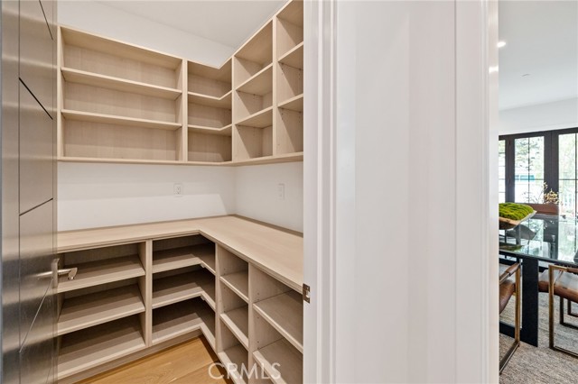 Abundant, curated storage solutions within the walk in pantry