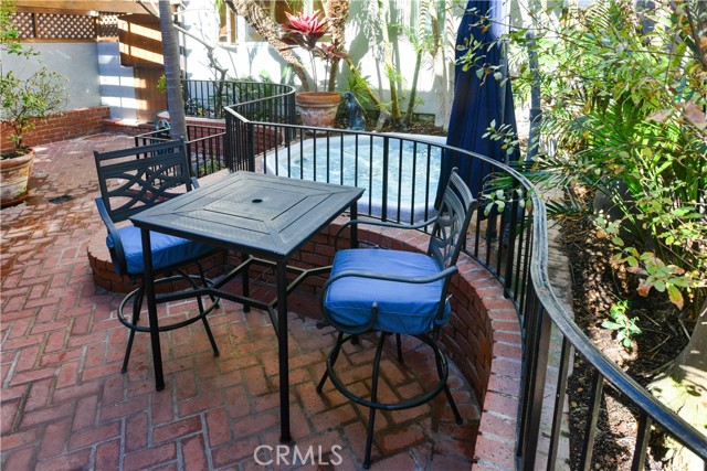 Private patio with tropical landscaping and heated spa.