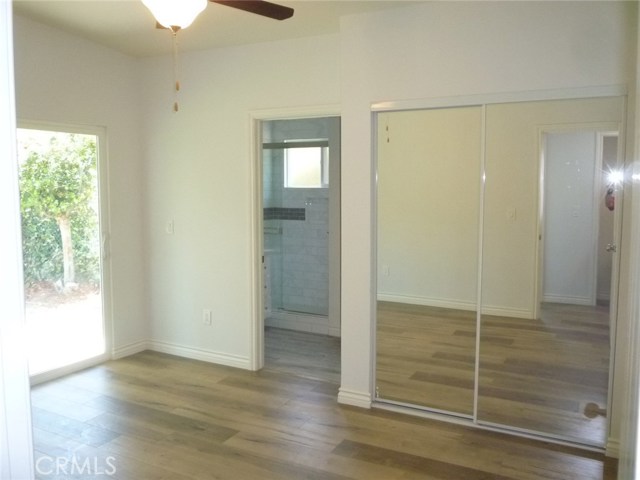 Bedroom 3 has a private bathroom as well making this the second master bedroom.  This bedroom has direct access to the beautiful backyard with mature trees.