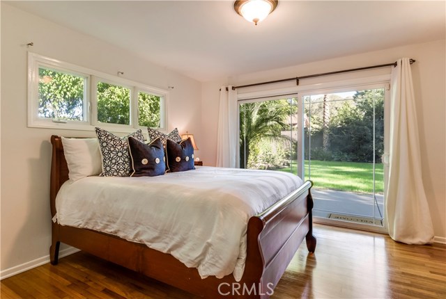 Guest bedroom overlooking private backyard