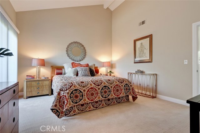 Enjoy this spacious room with vaulted ceilings and custom baseboards.