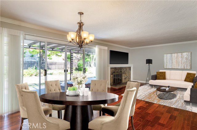 Virtually Staged Dining Area and Living Room looking into backyard