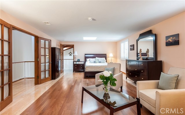 Gigantic Master bedroom on 2nd level has hardwood floors, big skylight, sitting area, walk-in closet + private Master Bath.