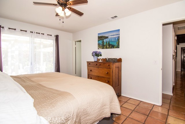 MASTER BEDROOM WITH CEILING FAN.