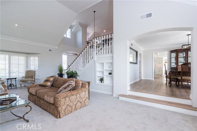 Another living room angle, facing the entry and the formal dining room to the right.  Kitchen is just beyond the dining room, and opens to the family room.