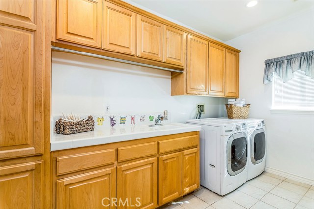 Laundry room featuring tons of additional storage