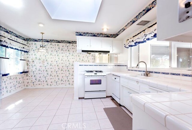 Big kitchen.  Pool view from sink window.  Ocean and parkland view from side window.