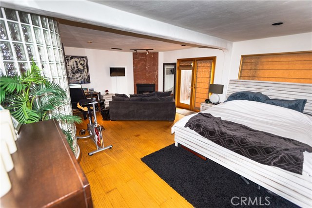 Master Bedroom with fireplace and hardwood floors