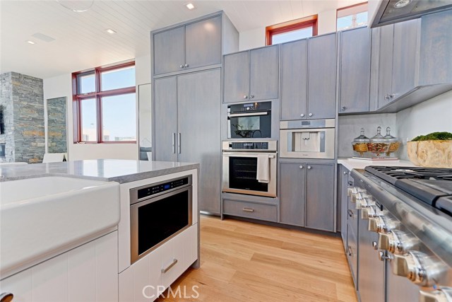 Farmhouse sink and custom-finished cabinetry