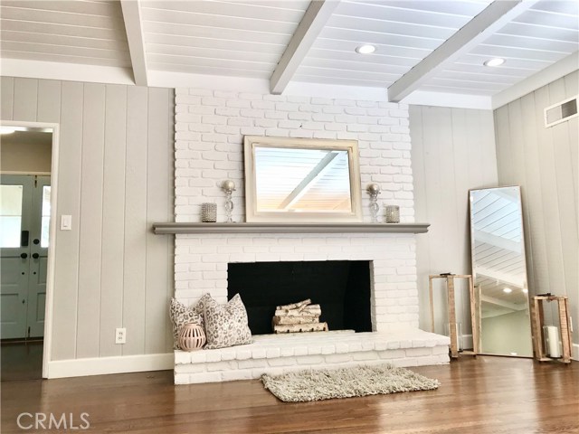 Beautifully restored large wood burning fireplace with hearth.