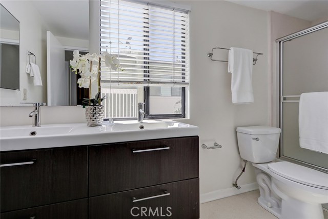 Updated hall bath with dual sinks, full bathtub with shower, extra cabinets for linen storage!