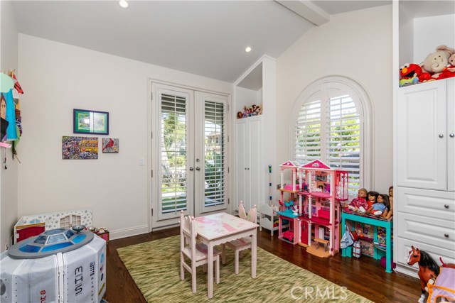 This bedroom could also be used as a home office, note the custom cabinetry
