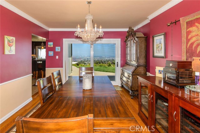 Formal dining room off kitchen...huge views that lead to the outdoor wrap around deck and rear yard.