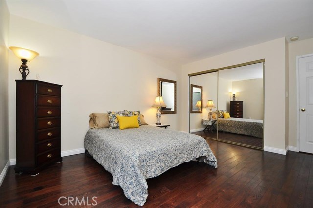 This bedroom, and the Master bedroom, have wood floors and mirrored wardrobes with closet organizers.  Raised panel doors and smooth ceilings can be found throughout this Unit.