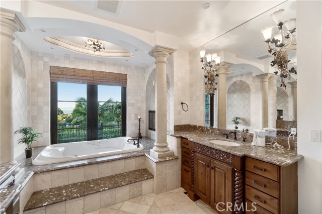 Master Bathroom with its ocean view, shares a double sided fireplace with master bedroom.