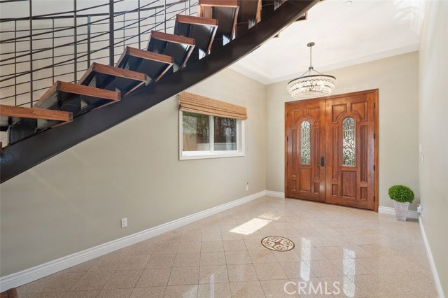 Entrance at front of home leading to stairway and open first floor living area.