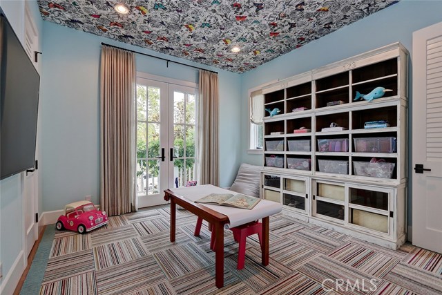 Entry Level ensuite bedroom currently used as a playroom