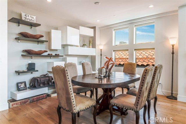 Dining room with dramatic floating shelves and cabinets