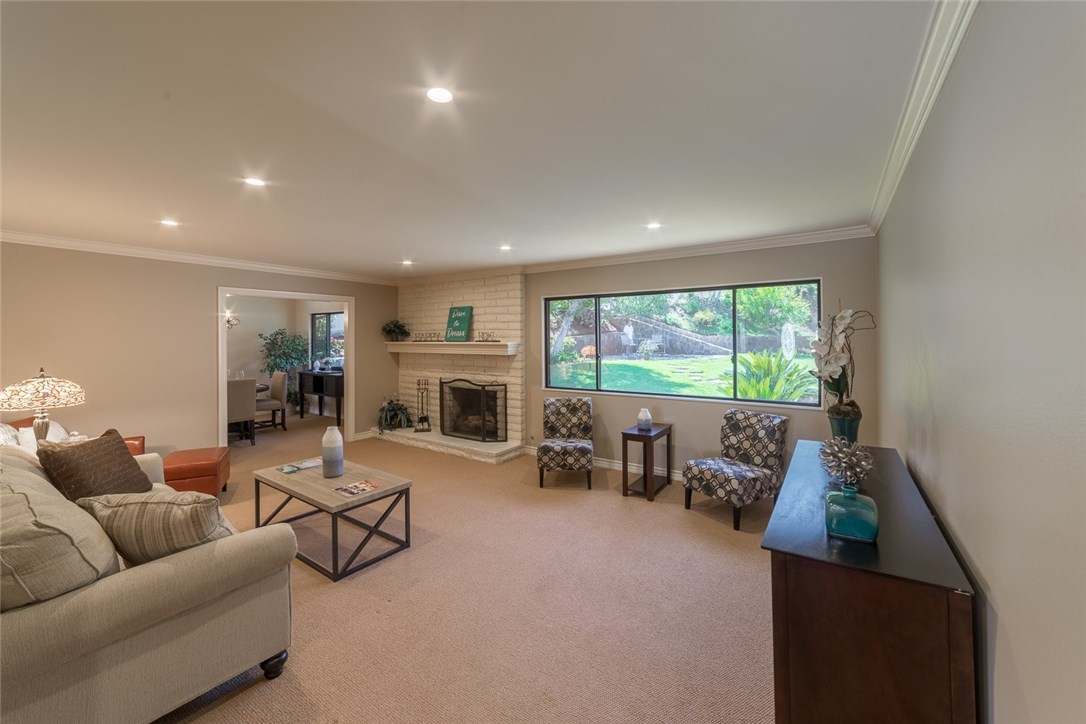 Relax in this beautiful living room with fireplace and a view too...