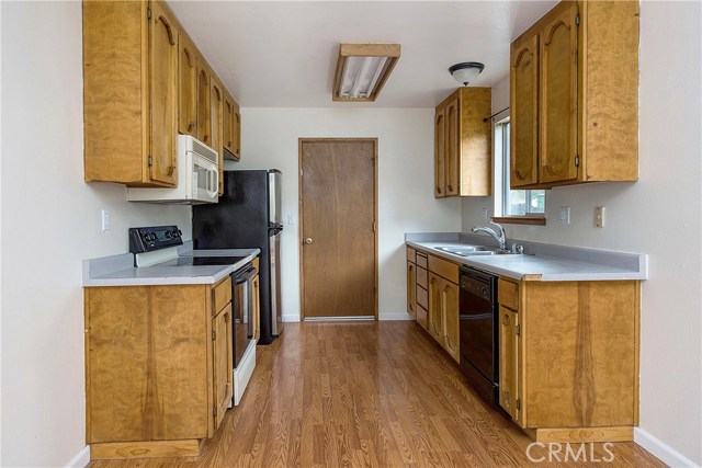 Galley-style kitchen with door to garage