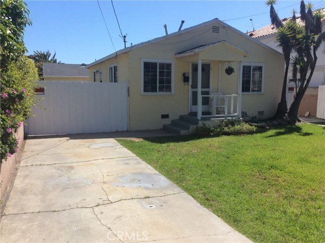 Driveway on left side leads to private garage and yard for front house